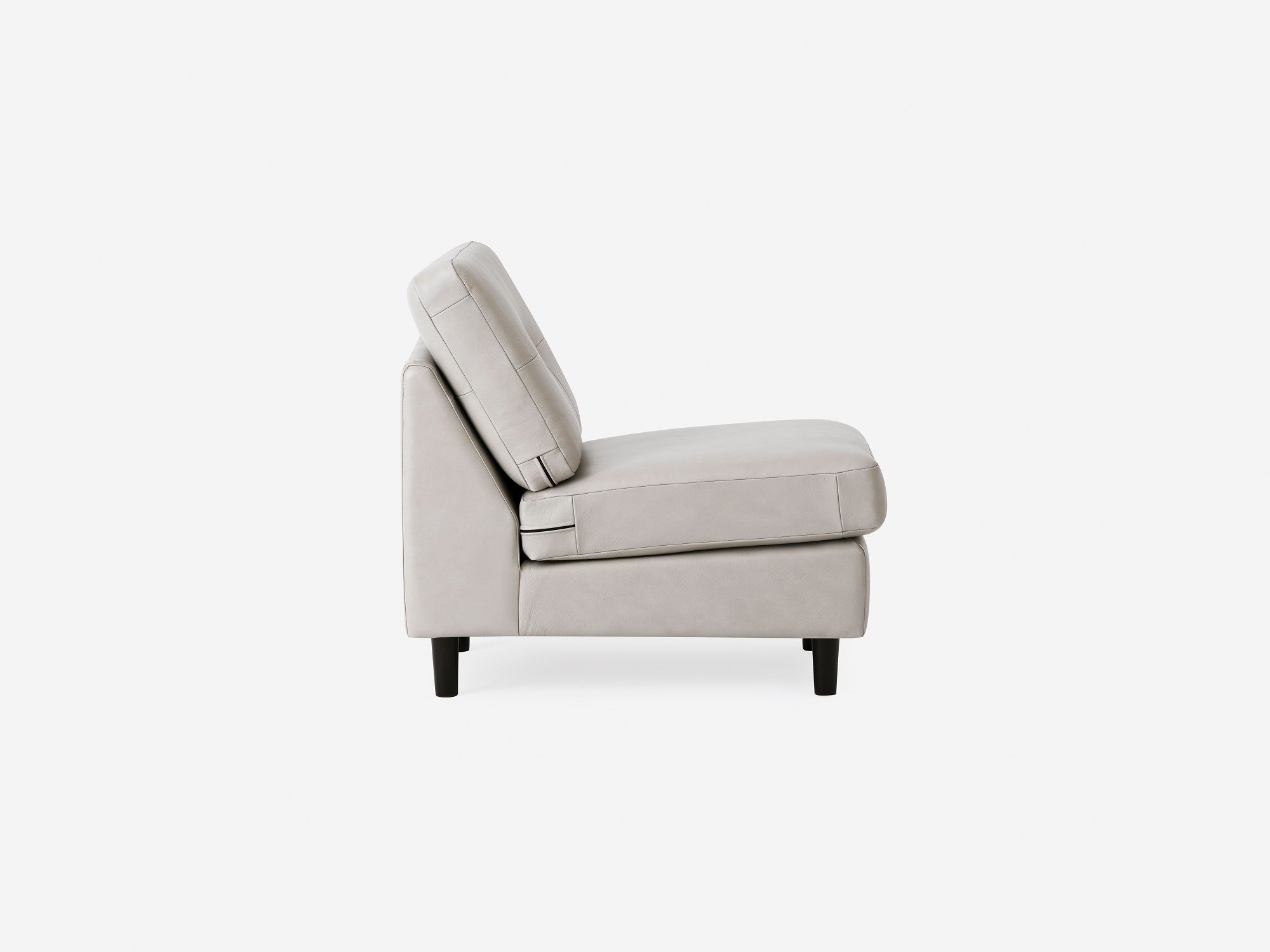 Side view of the Solo modern armless chair in white leather